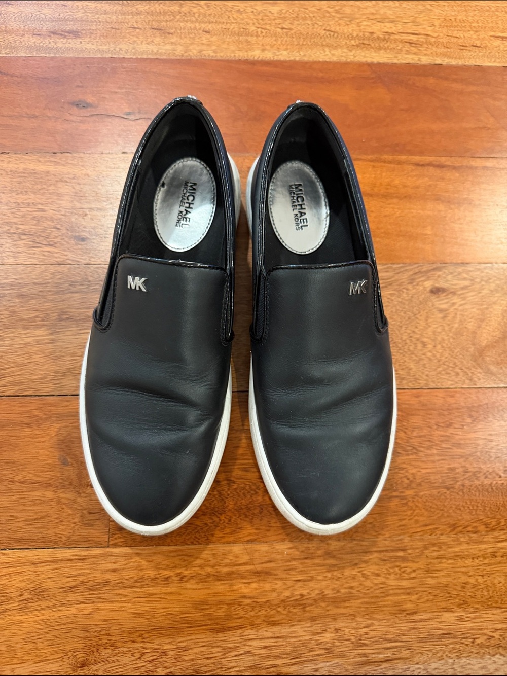 Michael Kors Black Leather Slip-On Sneakers with White Soles